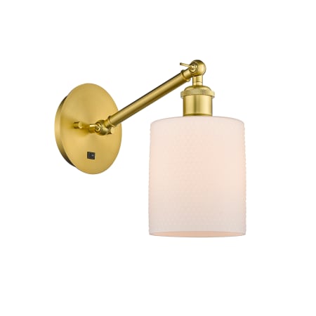 A large image of the Innovations Lighting 317-1W-13-6 Cobbleskill Sconce Satin Gold / Matte White