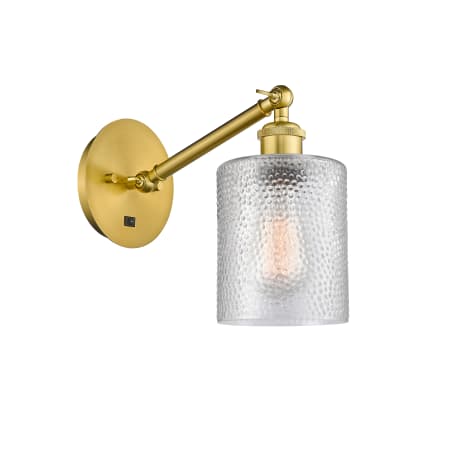 A large image of the Innovations Lighting 317-1W-13-5 Cobbleskill Sconce Satin Gold / Clear