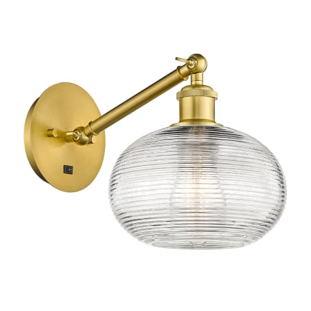 A large image of the Innovations Lighting 317-1W-9-8 Ithaca Sconce Satin Gold / Clear Ithaca