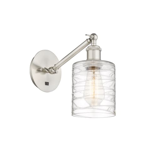 A large image of the Innovations Lighting 317-1W-13-5 Cobbleskill Sconce Brushed Satin Nickel / Deco Swirl