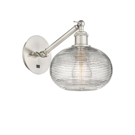 A large image of the Innovations Lighting 317-1W-9-8 Ithaca Sconce Brushed Satin Nickel / Clear Ithaca