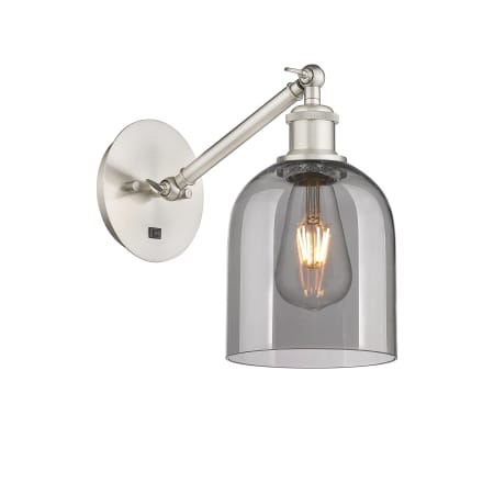 A large image of the Innovations Lighting 317-1W-10-6 Bella Sconce Brushed Satin Nickel / Light Smoke