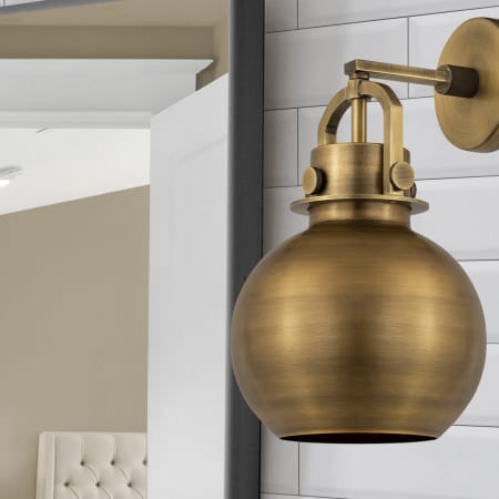 A large image of the Innovations Lighting 410-1W-5-8 Newton Sphere Sconce Alternate Image