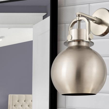 A large image of the Innovations Lighting 410-1W-5-8 Newton Sphere Sconce Alternate Image