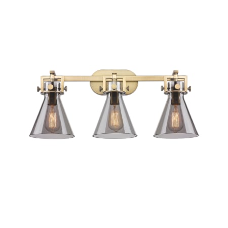 A large image of the Innovations Lighting 411-3W-12-27 Newton Cone Vanity Brushed Brass / Plated Smoke