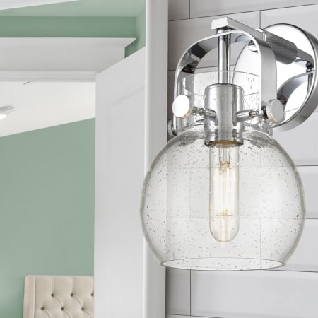 A large image of the Innovations Lighting 423-1W-10-7 Pilaster II Sphere Sconce Alternate Image