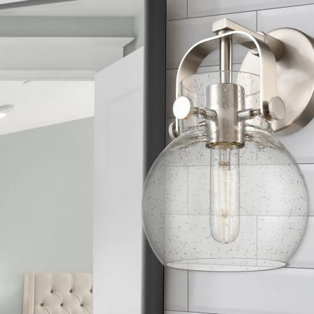 A large image of the Innovations Lighting 423-1W-10-7 Pilaster II Sphere Sconce Alternate Image