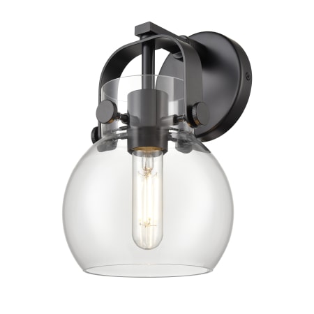 A large image of the Innovations Lighting 423-1W-10-7 Pilaster II Sphere Sconce Matte Black / Clear