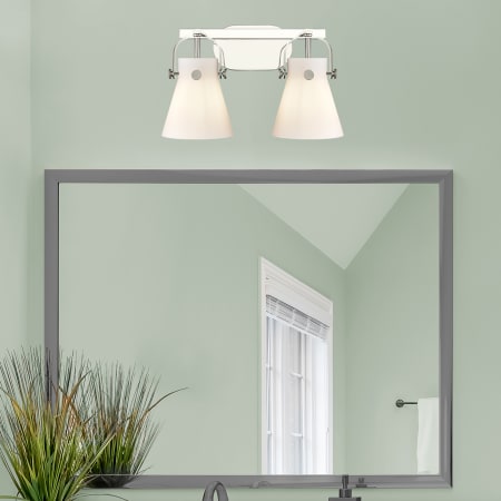 A large image of the Innovations Lighting 423-2W-10-17 Pilaster II Cone Vanity Alternate Image