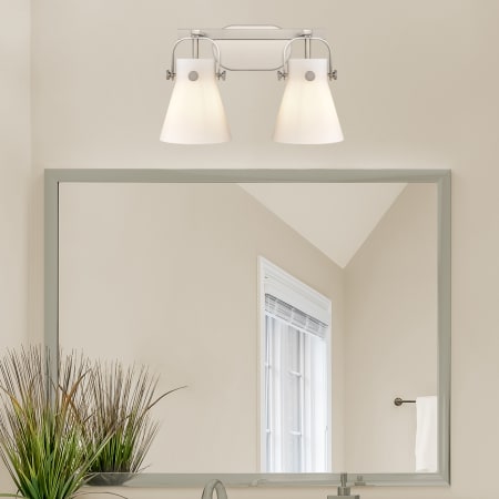 A large image of the Innovations Lighting 423-2W-10-17 Pilaster II Cone Vanity Alternate Image