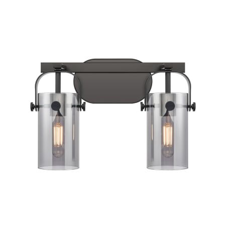 A large image of the Innovations Lighting 423-2W-10-15 Pilaster II Cylinder Vanity Matte Black / Plated Smoke