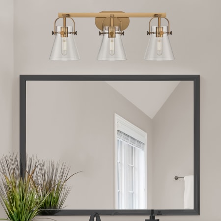 A large image of the Innovations Lighting 423-3W-10-27 Pilaster II Cone Vanity Alternate Image