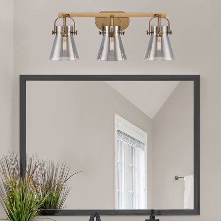 A large image of the Innovations Lighting 423-3W-10-27 Pilaster II Cone Vanity Alternate Image