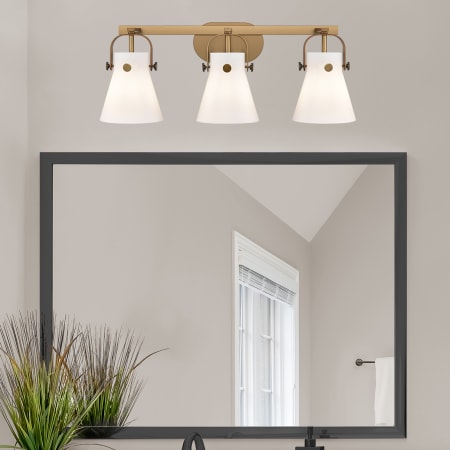 A large image of the Innovations Lighting 423-3W-10-27 Pilaster II Cone Vanity Alternate Image