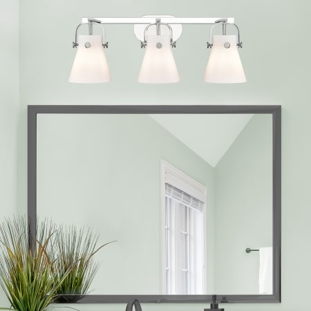 A large image of the Innovations Lighting 423-3W-10-27 Pilaster II Cone Vanity Alternate Image