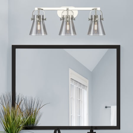 A large image of the Innovations Lighting 423-3W-10-27 Pilaster II Cone Vanity Alternate Image