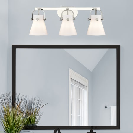 A large image of the Innovations Lighting 423-3W-10-27 Pilaster II Cone Vanity Alternate Image