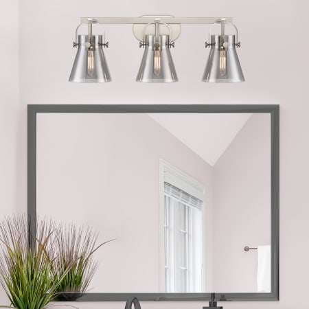 A large image of the Innovations Lighting 423-3W-10-27 Pilaster II Cone Vanity Alternate Image