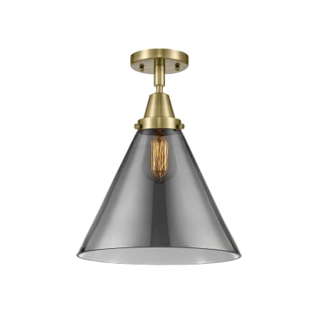 A large image of the Innovations Lighting 447-1C-16-12-L Cone Semi-Flush Antique Brass / Plated Smoke