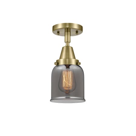 A large image of the Innovations Lighting 447-1C-10-5 Bell Semi-Flush Antique Brass / Plated Smoke