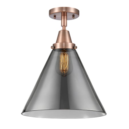A large image of the Innovations Lighting 447-1C-16-12-L Cone Semi-Flush Antique Copper / Plated Smoke