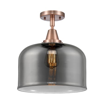 A large image of the Innovations Lighting 447-1C-13-12-L Bell Semi-Flush Antique Copper / Plated Smoke