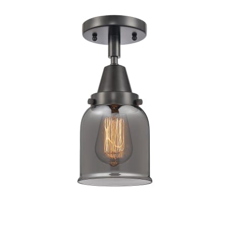 A large image of the Innovations Lighting 447-1C-10-5 Bell Semi-Flush Matte Black / Plated Smoke