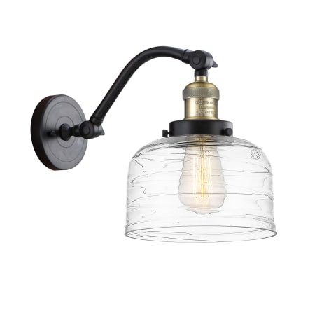 A large image of the Innovations Lighting 515-1W-12-8 Bell Sconce Black Antique Brass / Clear Deco Swirl