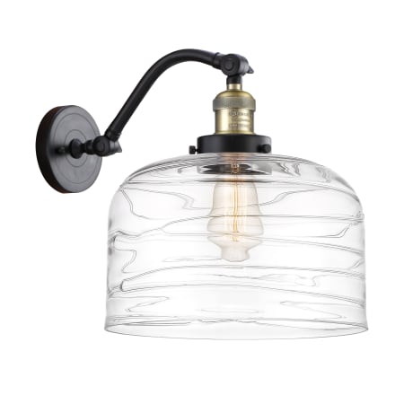 A large image of the Innovations Lighting 515-1W-13-12-L Bell Sconce Black Antique Brass / Clear Deco Swirl