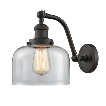 A large image of the Innovations Lighting 515-1W Large Bell Oiled Rubbed Bronze / Clear