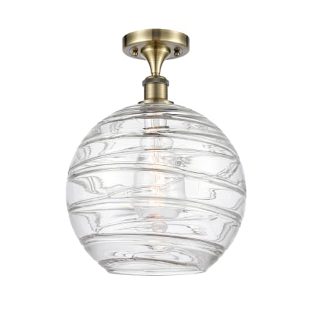 A large image of the Innovations Lighting 516-1C-17-12 Athens Semi-Flush Antique Brass / Clear Deco Swirl