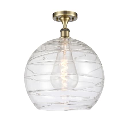 A large image of the Innovations Lighting 516-1C-17-14 Athens Semi-Flush Antique Brass / Clear Deco Swirl