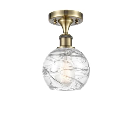 A large image of the Innovations Lighting 516-1C-11-6 Athens Semi-Flush Antique Brass / Clear Deco Swirl