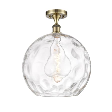 A large image of the Innovations Lighting 516-1C-17-14 Athens Semi-Flush Antique Brass / Clear Water Glass