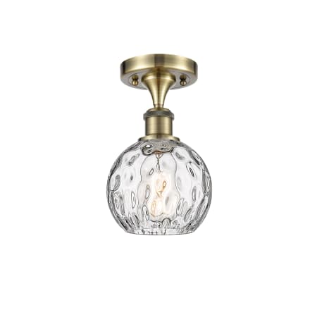A large image of the Innovations Lighting 516-1C-11-6 Athens Semi-Flush Antique Brass / Clear Water Glass