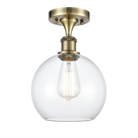 A large image of the Innovations Lighting 516-1C-13-8 Athens Semi-Flush Antique Brass / Clear