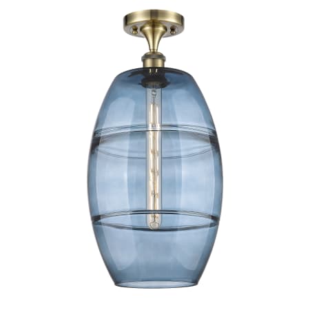 A large image of the Innovations Lighting 516-1C-20-10 Vaz Semi-Flush Antique Brass / Blue