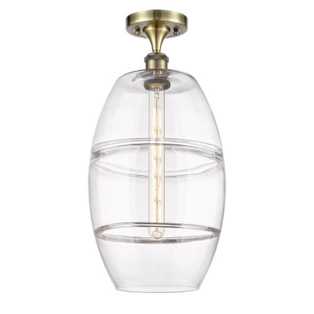 A large image of the Innovations Lighting 516-1C-20-10 Vaz Semi-Flush Antique Brass / Clear