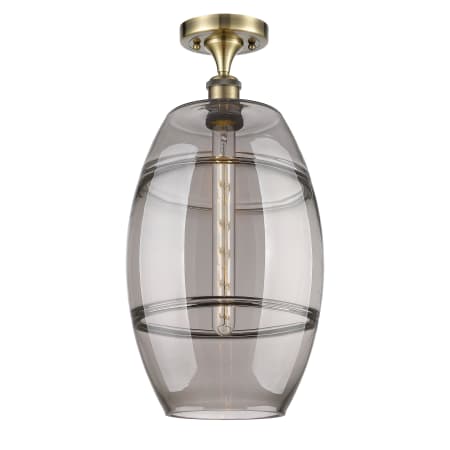 A large image of the Innovations Lighting 516-1C-20-10 Vaz Semi-Flush Antique Brass / Smoked