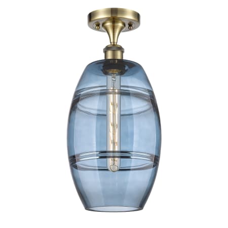 A large image of the Innovations Lighting 516-1C-12-8 Vaz Semi-Flush Antique Brass / Blue