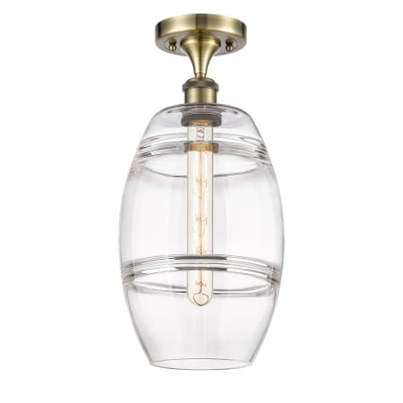 A large image of the Innovations Lighting 516-1C-12-8 Vaz Semi-Flush Antique Brass / Clear