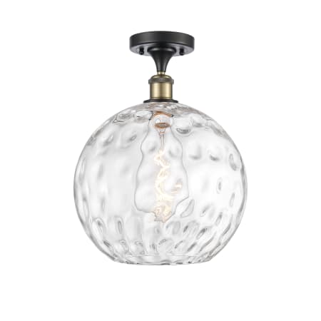A large image of the Innovations Lighting 516-1C-17-12 Athens Semi-Flush Black Antique Brass / Clear Water Glass