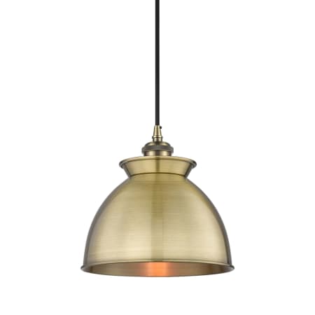 A large image of the Innovations Lighting 516-1P-10-9 Adirondack Pendant Antique Brass