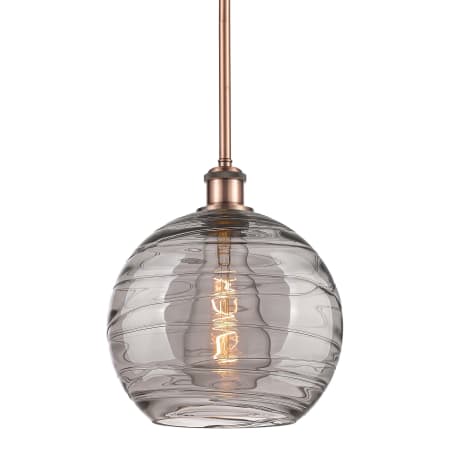 A large image of the Innovations Lighting 516-1S-12-10 Athens Deco Swirl Pendant Antique Copper / Light Smoke Deco Swirl