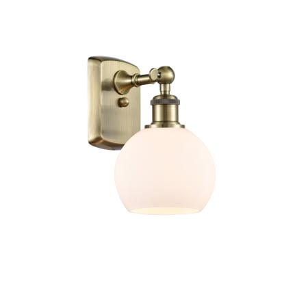 A large image of the Innovations Lighting 516-1W-10-6 Athens Sconce Antique Brass / Matte White