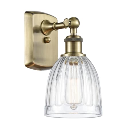 A large image of the Innovations Lighting 516-1W-9-6 Brookfield Sconce Antique Brass / Clear