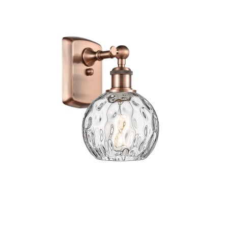 A large image of the Innovations Lighting 516-1W-11-6 Athens Sconce Antique Copper / Clear Water Glass