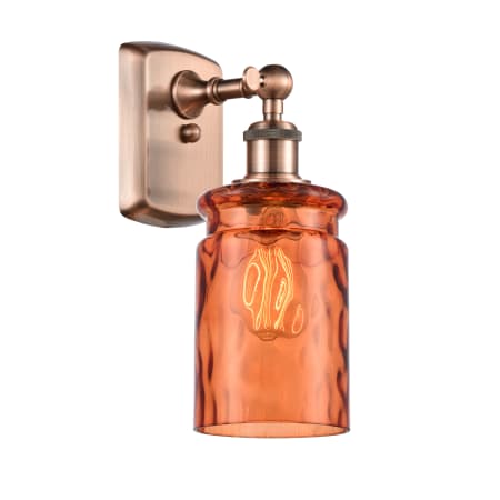 A large image of the Innovations Lighting 516-1W Candor Antique Copper / Turmeric Waterglass
