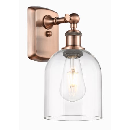 A large image of the Innovations Lighting 516-1W-11-6 Bella Sconce Antique Copper / Clear