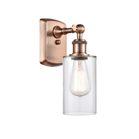 A large image of the Innovations Lighting 516-1W-12-4 Clymer Sconce Antique Copper / Clear